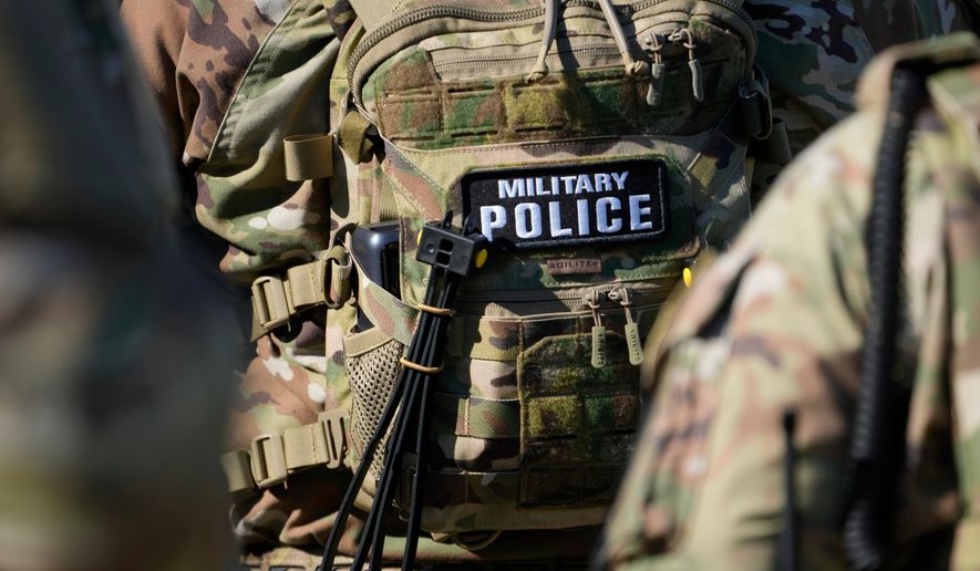 Members from the National Guard working as part of the Memphis Safe Task Force conduct a community safety patrol at Tom Lee Park, Oct. 12, 2025, in Memphis, Tenn. (AP Photo/George Walker IV, File)