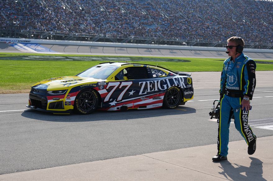 Carson Hocevar (77) drives to the track during a NASCAR Cup Series auto race at Chicagoland Speedway in Joliet, Ill., Sunday, July 5, 2026. (AP Photo/Nam Y. Huh)