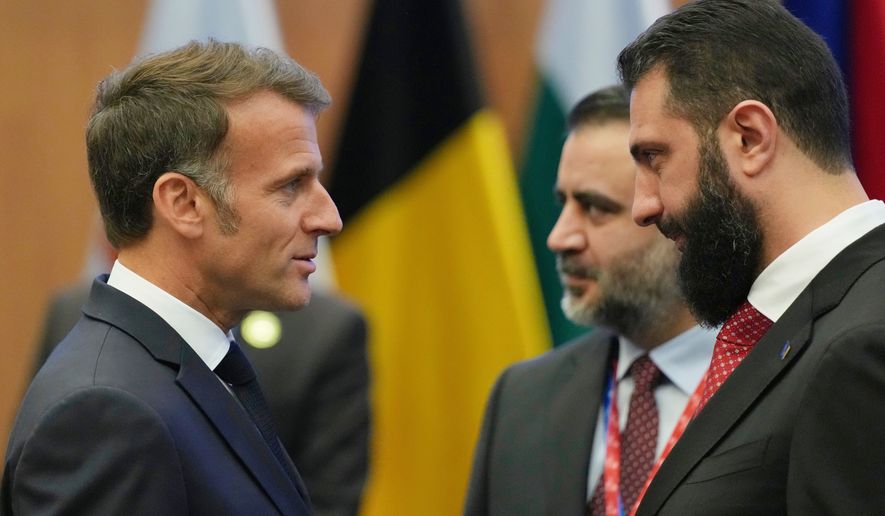 FILE - French President Emmanuel Macron, left, talks with the Syrian President Ahmad al-Sharaa during the EU Summit in Nicosia, Cyprus, April 24, 2026. (AP Photo/Petros Karadjias, File)