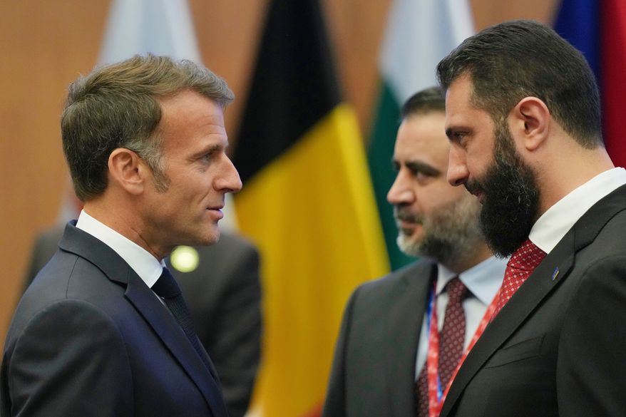 FILE - French President Emmanuel Macron, left, talks with the Syrian President Ahmad al-Sharaa during the EU Summit in Nicosia, Cyprus, April 24, 2026. (AP Photo/Petros Karadjias, File)