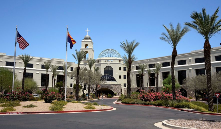 Mercy Gilbert Medical Center, shown here, where an 18-month-old toddler discovered in a backyard pool and taken to the hospital in February, was declared dead before being found breathing hours later in a room that serves as the hospital morgue, according to recently released police records, Monday, July 6, 2026, in Gilbert, Ariz. (AP Photo/Ross D. Franklin)