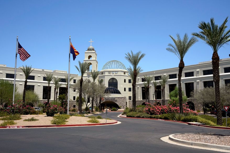 Mercy Gilbert Medical Center, shown here, where an 18-month-old toddler discovered in a backyard pool and taken to the hospital in February, was declared dead before being found breathing hours later in a room that serves as the hospital morgue, according to recently released police records, Monday, July 6, 2026, in Gilbert, Ariz. (AP Photo/Ross D. Franklin)