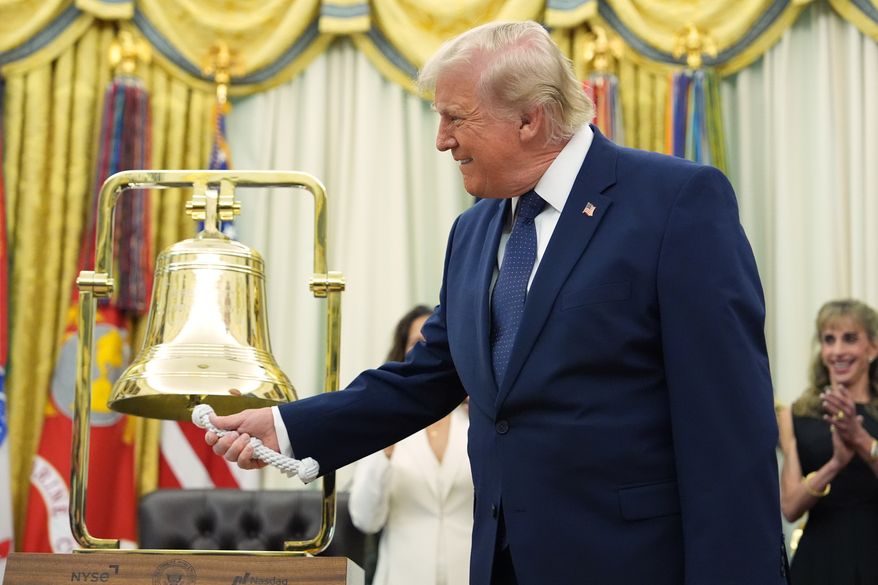 President Donald Trump rings the opening bell for the New York Stock Exchange and the Nasdaq markets in the Oval Office at the White House, Monday, July 6, 2026, in Washington. (AP Photo/Mark Schiefelbein)