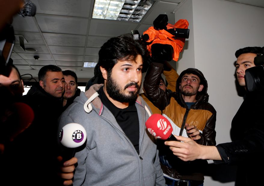 FILE - In this Tuesday, Dec. 17, 2013 photo, Turkish-Iranian businessman Reza Zarrab, who is charged currently in the U.S. for evading sanctions on Iran, is surrounded by the media members as he arrives at a courthouse in Istanbul, in a separate case against him. (Depo Photos via AP, File)
