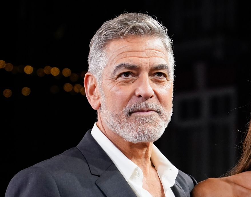 FILE - George Clooney appears at the screening of the film "The Boys In The Boat" in London on Dec. 3, 2023. (Photo by Alberto Pezzali/Invision/AP, File)