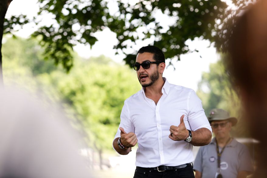Michigan U.S. Senate candidate, Abdul El-Sayed, is seen speaking to volunteers at a canvassing event at Riverside Park, Tuesday, July 7, 2026, Grand Rapids, Mich. (AP Photo/Kristen Norman)