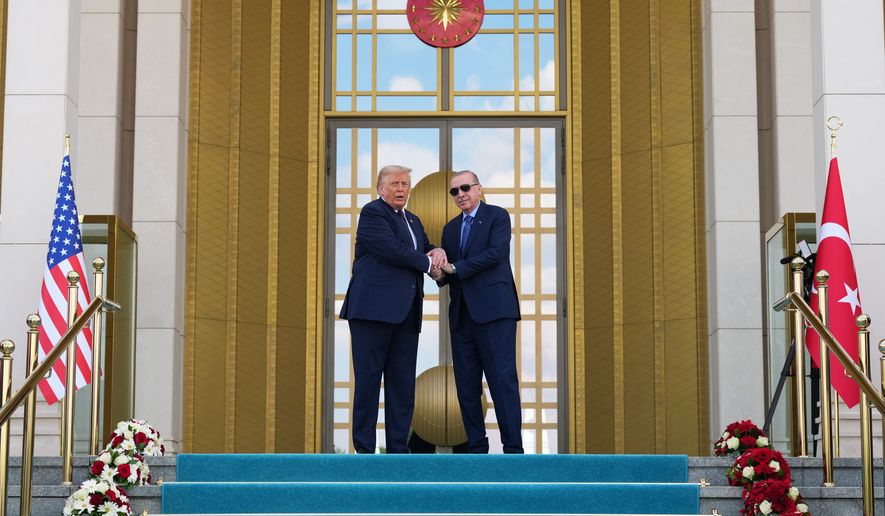 President Donald Trump shakes hands with Turkish President Recep Tayyip Erdogan at the Bestepe Presidential Palace during a formal welcome for the NATO summit in Ankara, Turkey, Tuesday, July 7, 2026.(AP Photo/Alex Brandon)