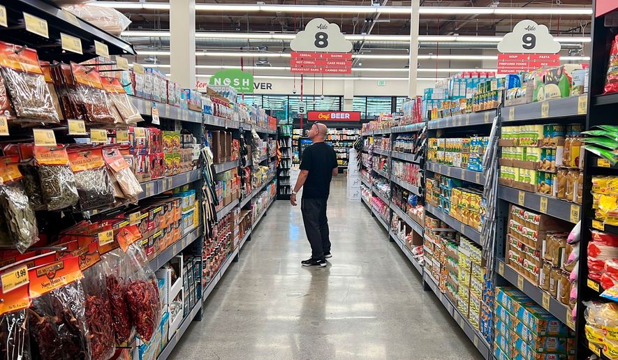 A customer shops at a Grocery Outlet store in Pleasanton, Calif., on Sept. 15, 2022. (AP Photo/Terry Chea, File)