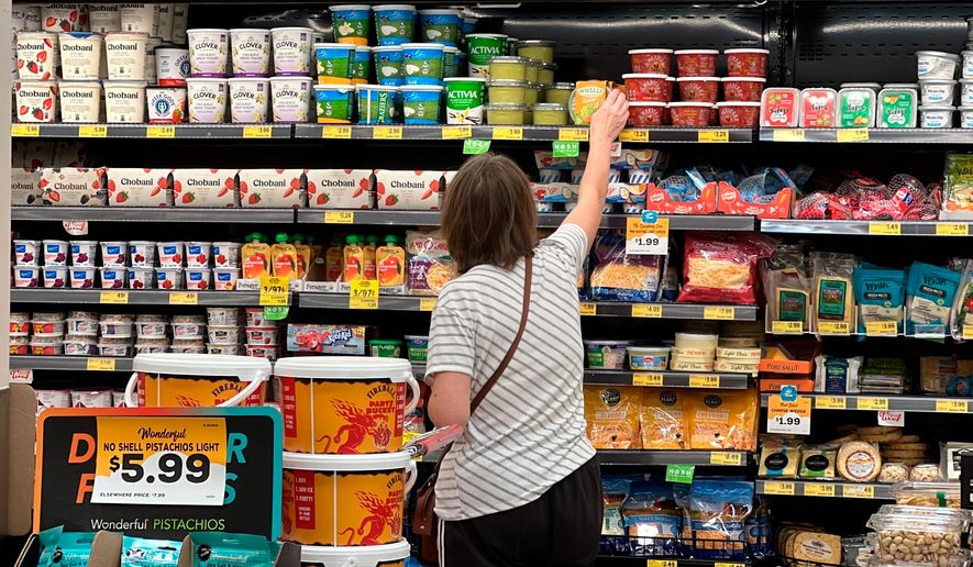 FILE - A customer looks at items at a Grocery Outlet store in Pleasanton, Calif.,. on Sept. 15, 2022. (AP Photo/Terry Chea, File)