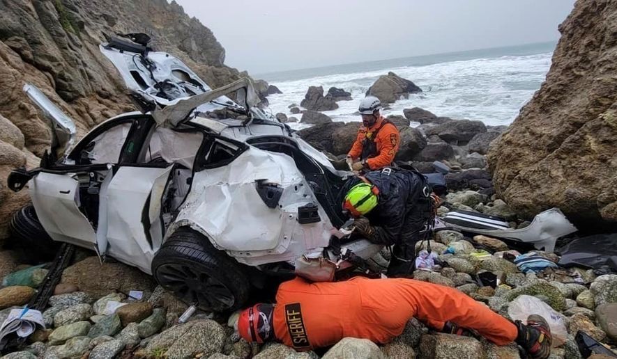 FILE - In this photo provided by the San Mateo County Sheriff's Office, emergency personnel respond to a vehicle over the side of Highway 1 on Jan. 1, 2023, in San Mateo County, Calif. (Sgt. Brian Moore/San Mateo County Sheriff's Office via AP, File)