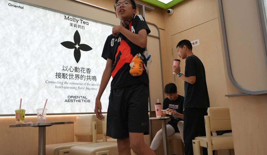 Chinese youth visit the Molly Tea shop in Beijing, China, Tuesday, July 7, 2026. (AP Photo/Ng Han Guan)