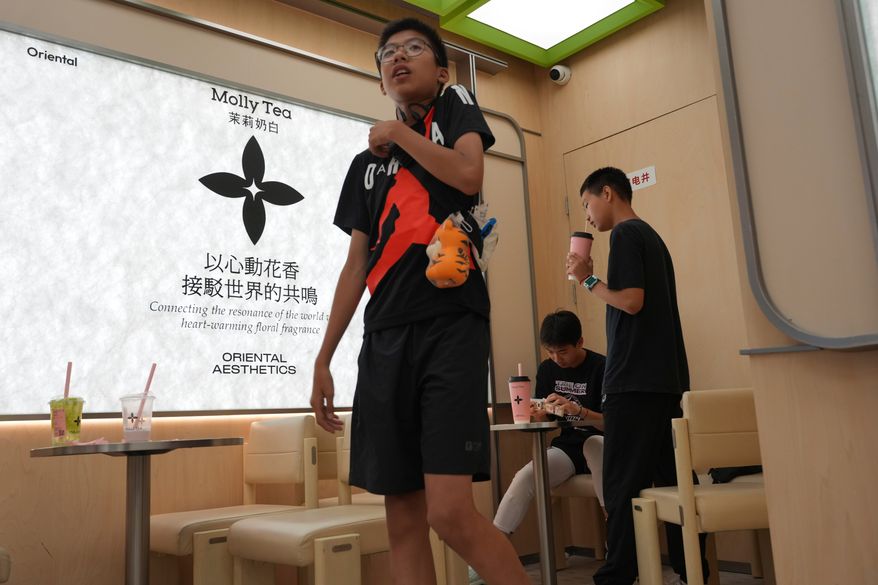 Chinese youth visit the Molly Tea shop in Beijing, China, Tuesday, July 7, 2026. (AP Photo/Ng Han Guan)