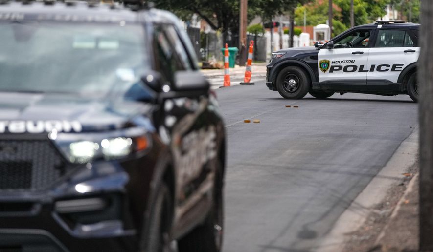 Police work on Canal Street in Houston, Tuesday, July 7, 2026, after a shooting. (Jacob Lujan/Houston Chronicle via AP)