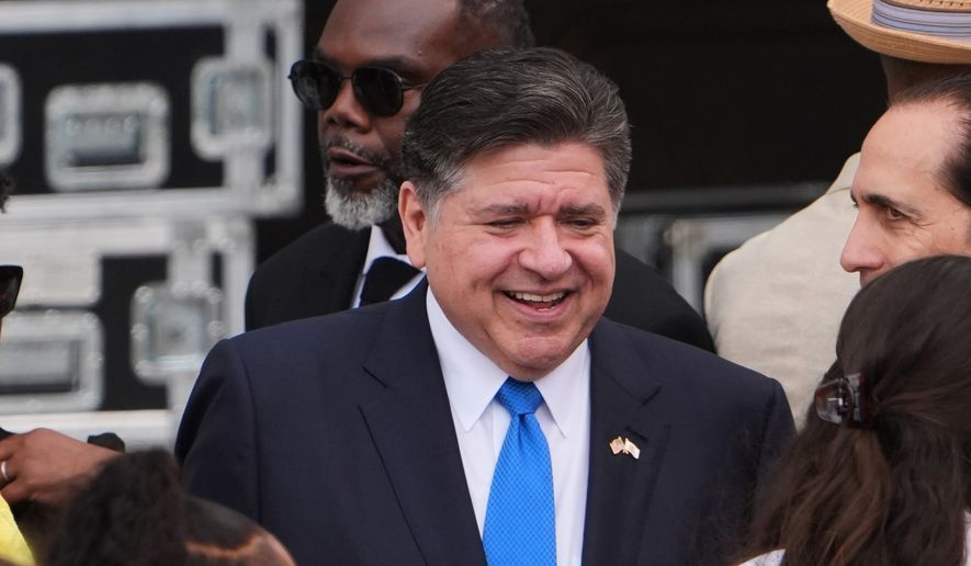 Illinois Gov. JB Pritzker, center, mingles ahead of the Obama Presidential Center dedication ceremony Thursday, June 18, 2026, in Chicago. (AP Photo/Jeff Roberson)