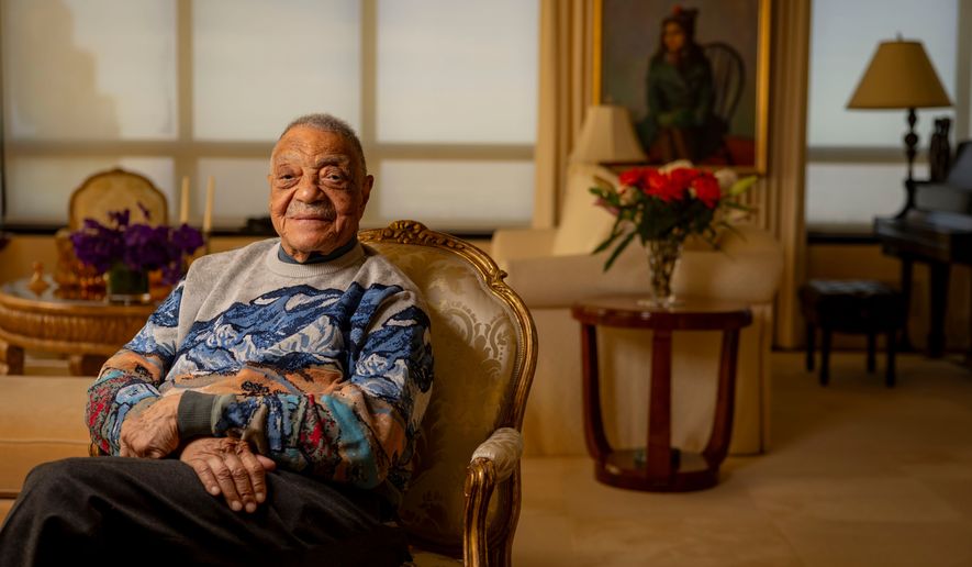 George E. Johnson Sr. sits in his Chicago home Tuesday, Feb. 18, 2025. (Brian Cassella/Chicago Tribune via AP)