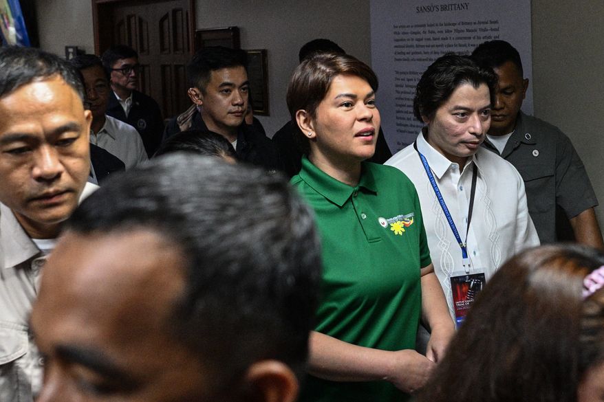 Philippine Vice President Sara Duterte, center, arrives before the start of the impeachment trial at the Senate of the Philippines in Pasay, Philippines Tuesday, July 7, 2026. (Noel Celis/Pool Photo via AP)