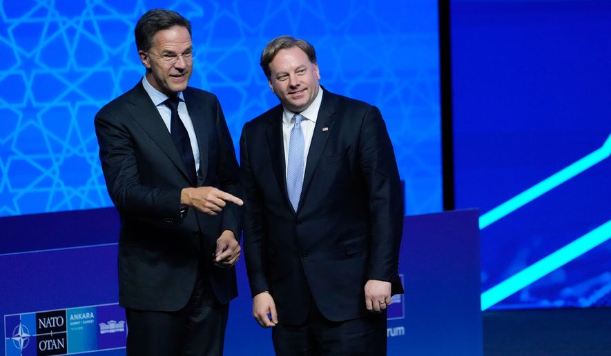 NATO Secretary-General Mark Rutte, left, speaks with U.S. Under Secretary of Defense for Acquisition and Sustainment Michael Duffey, during the NATO Defense Industry Forum at the NATO summit in Ankara, Turkey, Tuesday, July 7, 2026. (AP Photo/Hussein Malla)