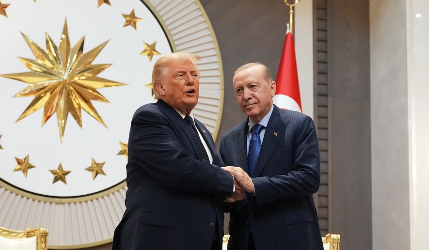 President Donald Trump shakes hands with Turkish President Recep Tayyip Erdogan upon arriving for the NATO summit in Ankara, Turkey, Tuesday, July 7, 2026. (AP Photo/Alex Brandon)