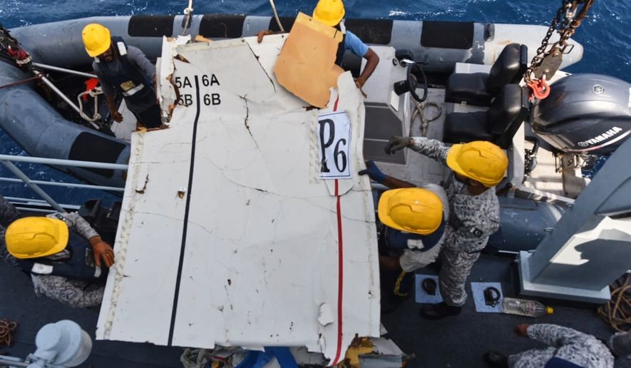 In this photo released by Pakistan Navy, Pakistan Navy personnel shift the wreckage of a cargo plane of the private carrier K2 Airways into a naval ship after recovering them from deep sea near Omara, a town some 360 kms. (220 miles) west of Karachi, Pakistan, Wednesday, July 8, 2026. (Pakistan Navy via AP)