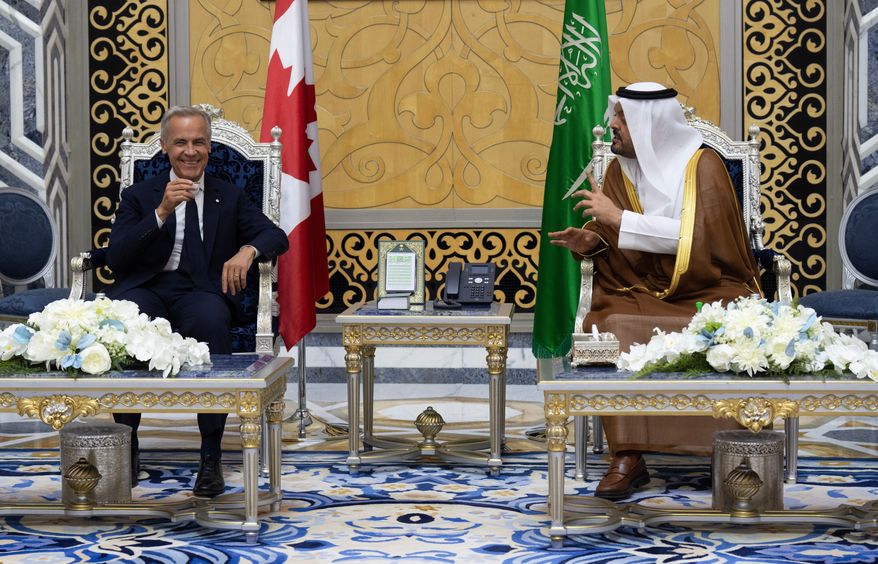 Canada Prime Minister Mark Carney participates in a welcome ceremony with Prince Saud bin Mishaal bin Abdulaziz Al Saud after arriving In Jeddah, Saudi Arabia, Wednesday, July 8, 2026. (Adrian Wyld/The Canadian Press via AP)
