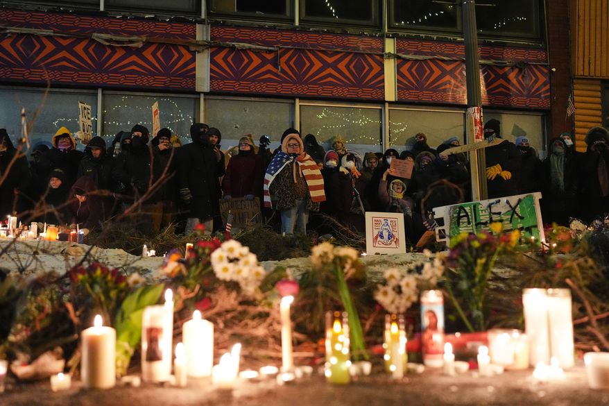 FILE - People gather during a vigil for 37-year-old Alex Pretti, who was fatally shot by a U.S. Border Patrol officer earlier in the day, Jan. 24, 2026, in Minneapolis. (AP Photo/Adam Gray, File)