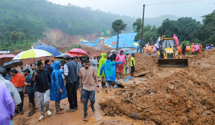This photograph released by the Kerala Public Relations department shows rescue operations after a landslide near Meppadi tunnel project in Wayanad, in the southern state of Kerala, India, Tuesday, July 7, 2026. (Kerala Public Relations department via AP)