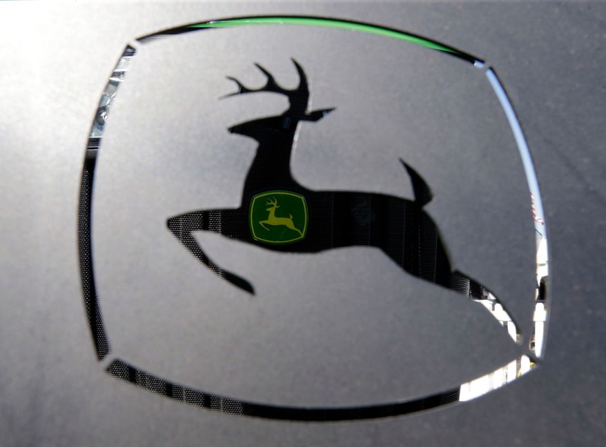 FILE - A John Deer emblem is seen at the Husker Harvest Days farm show in Wood River, Neb., Sept. 12, 2018. (AP Photo/Nati Harnik, File)