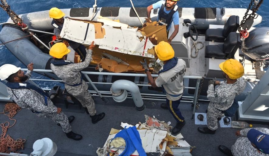 In this photo released by Pakistan Navy, Pakistan Navy personnel shift the wreckage of a cargo plane of the private carrier K2 Airways into a naval ship after recovering them from deep sea near Omara, a town some 360 kms. (220 miles) west of Karachi, Pakistan, Wednesday, July 8, 2026. (Pakistan Navy via AP)