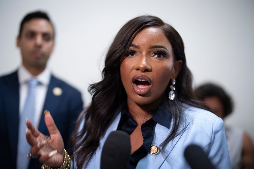 Rep. Jasmine Crockett, D-Texas, a member of the House Oversight and Government Reform Committee, speaks to reporters outside the closed hearing room where Bill Gates is answering questions about convicted sex offender Jeffrey Epstein, in Washington, Wednesday, June 10, 2026. (AP Photo/J. Scott Applewhite)