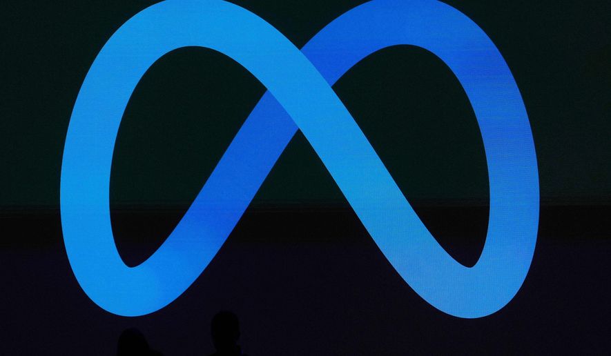 FILE - A Meta logo is shown on a video screen at LlamaCon 2025, an AI developer conference, in Menlo Park, Calif., April 29, 2025. (AP Photo/Jeff Chiu, File)