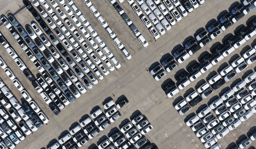 An aerial view of new cars awaiting export to overseas markets is seen at a port in Shanghai, March 10, 2026. (Chinatopix via AP, File)