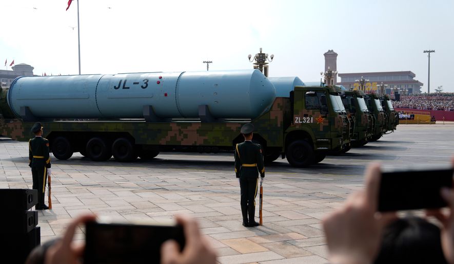 Chinese military vehicles carrying JL-3 submarine-launched missiles on armoured vehicles take part in a military parade to commemorate the 80th anniversary of Japan's World War II surrender held in front of Tiananmen Gate in Beijing, Wednesday, Sept. 3, 2025. (AP Photo/Ng Han Guan)