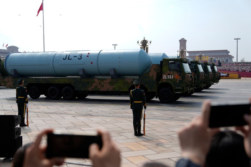 Chinese military vehicles carrying JL-3 submarine-launched missiles on armoured vehicles take part in a military parade to commemorate the 80th anniversary of Japan's World War II surrender held in front of Tiananmen Gate in Beijing, Wednesday, Sept. 3, 2025. (AP Photo/Ng Han Guan)