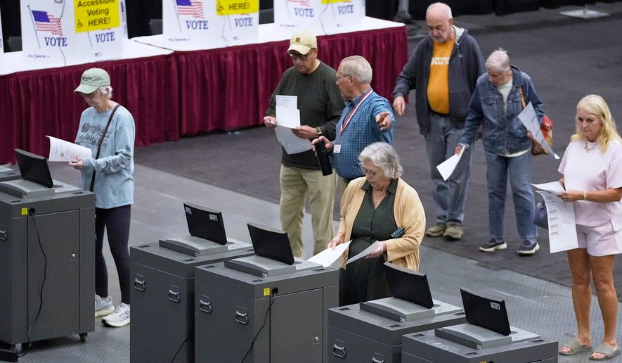 FILE - Voter cast their Maine primary ballots at the Civic Center, June 9, 2026, in Augusta, Maine. (AP Photo/Robert F. Bukaty, File)