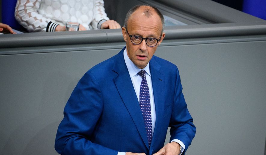 German Chancellor Friedrich Merz delivers a government statement on the current political situation during the 89th plenary session of the 21st legislative period in the German Bundestag, Thursday, July 9, 2026. (Bernd von Jutrczenka/dpa via AP)