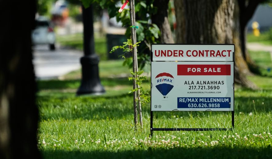 A under contract for home sale sign is seen outside of a home in Niles, Ill., Thursday, June 25, 2026. (AP Photo/Nam Y. Huh)