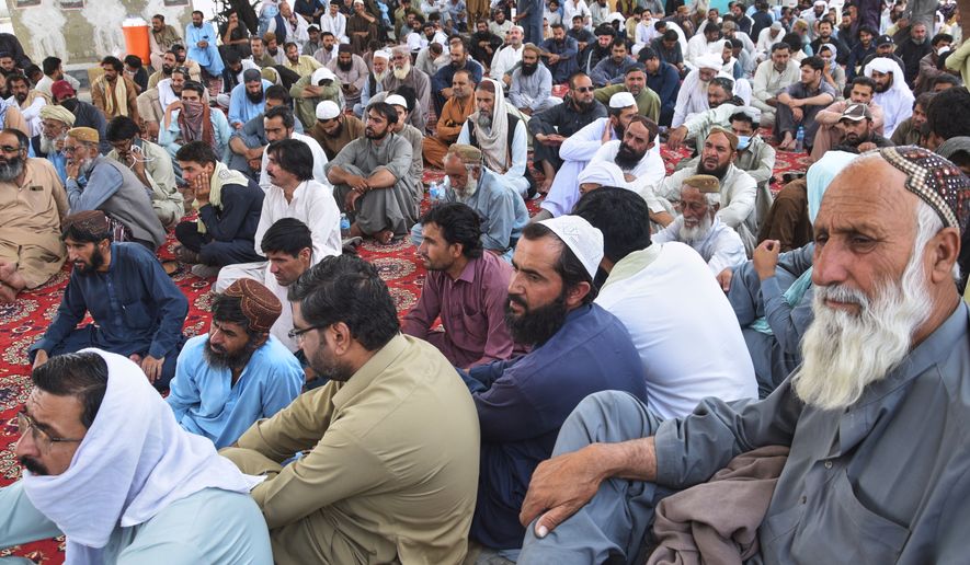 Mourners hold a sit-in protest against the abduction and killing of police officers by insurgents at a roadside in Quetta, Pakistan, Thursday, July 9, 2026. (AP Photo/Arshad Butt)