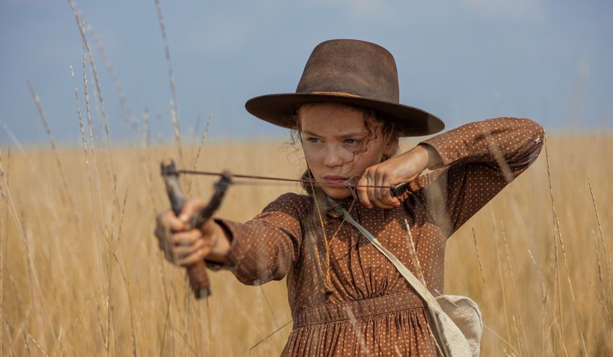 This image released by Netflix shows Alice Halsey as Laura Ingalls in a scene from "Little House on the Prairie." (Eric Zachanowich/Netflix via AP)