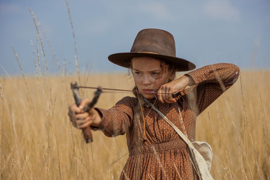 This image released by Netflix shows Alice Halsey as Laura Ingalls in a scene from "Little House on the Prairie." (Eric Zachanowich/Netflix via AP)