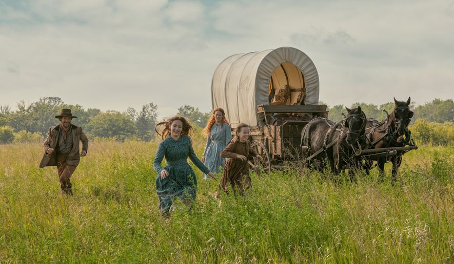 This image released by Netflix shows, from left, Luke Bracey as Charles Ingalls, Skywalker Hughes as Mary Ingalls, Crosby Fitzgerald as Caroline Ingalls, and Alice Halsey as Laura Ingalls, in a scene from "Little House on the Prairie." (Eric Zachanowich/Netflix via AP)