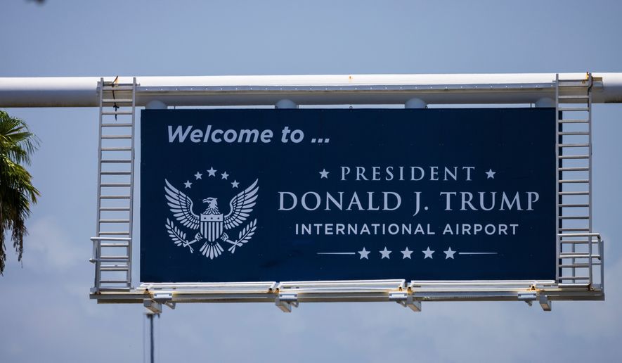 A sign displaying the name of the rebranded Donald J. Trump International Airport in West Palm Beach, Fla., is seen Thursday, July 9, 2026. (AP Photo/Saul Martinez)