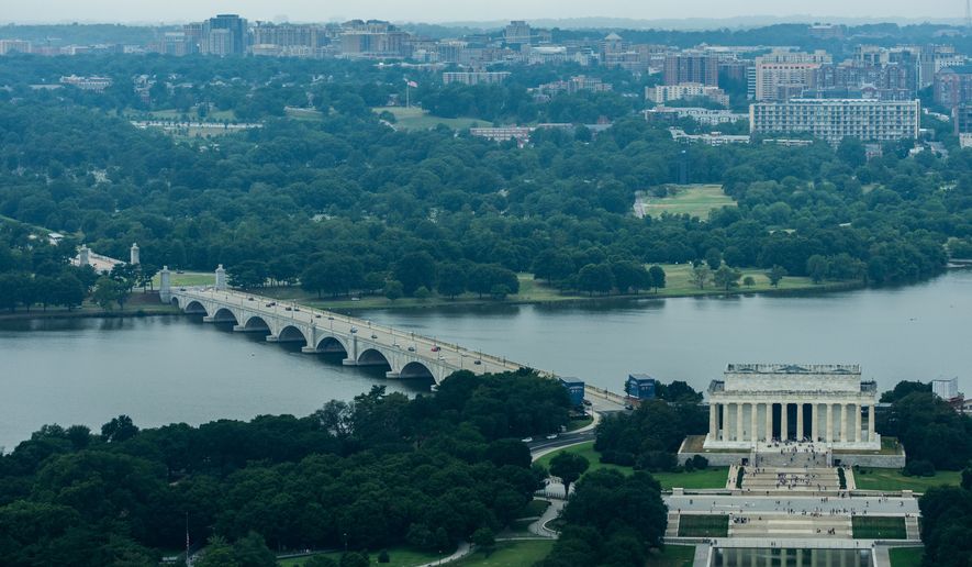 Memorial Circle, where President Donald Trump has proposed building an arch to commemorate the United States' 250th anniversary, the Arlington Memorial Bridge and the Lincoln Memorial are seen from the Washington Monument, Thursday, July 9, 2026, in Washington. (AP Photo/Julia Demaree Nikhinson)