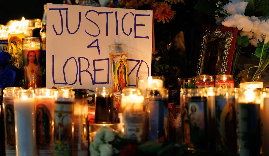 Candles are lit during a vigil for Lorenzo Salgado Araujo, a Mexican national fatally shot by a federal immigration agent a day prior, Wednesday, July 8, 2026, in Houston. (AP Photo/Mark Felix)