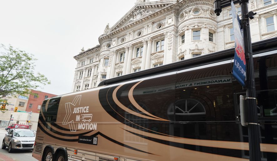 A tour bus carrying retired judges on a tour through the Rust Belt to defend judicial independence is parted outside the Westmoreland County Courthouse in Greensburg, Pa., on Tuesday, July 7, 2026. (Keep Our Republic via AP)