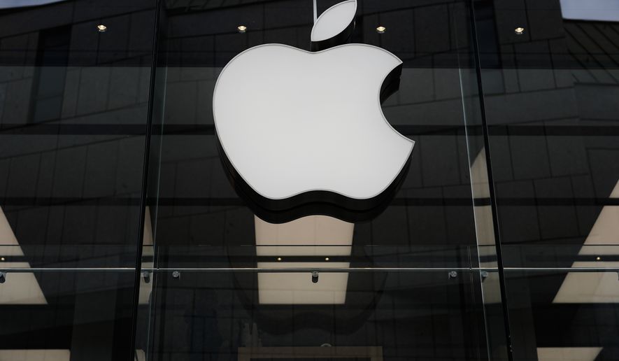 The Apple logo is illuminated at a store in Munich, April 2, 2026. (AP Photo/Matthias Schrader, File)