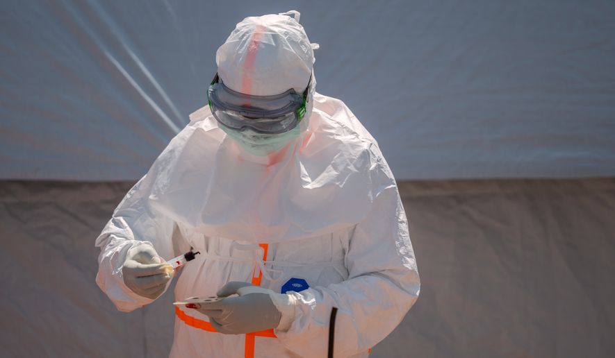 A health worker prepares a patient's blood sample for testing at Bunia General Hospital in Bunia, Congo, Thursday, June 11, 2026. (AP Photo/Moses Sawasawa, File)