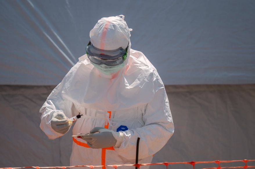 A health worker prepares a patient's blood sample for testing at Bunia General Hospital in Bunia, Congo, Thursday, June 11, 2026. (AP Photo/Moses Sawasawa, File)