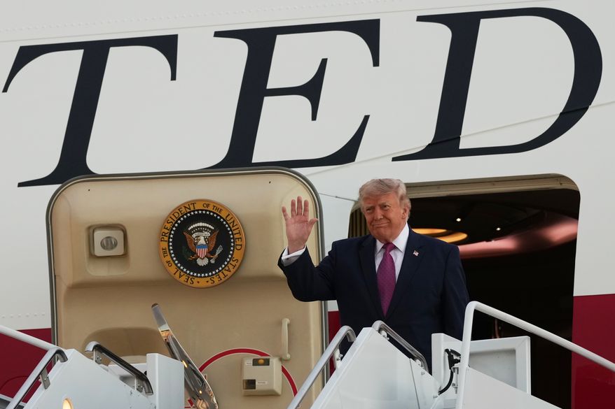 President Donald Trump waves as he arrives on Air Force One at Ellsworth Air Force Base, S.D., Friday, July 3, 2026. (AP Photo/Alex Brandon)