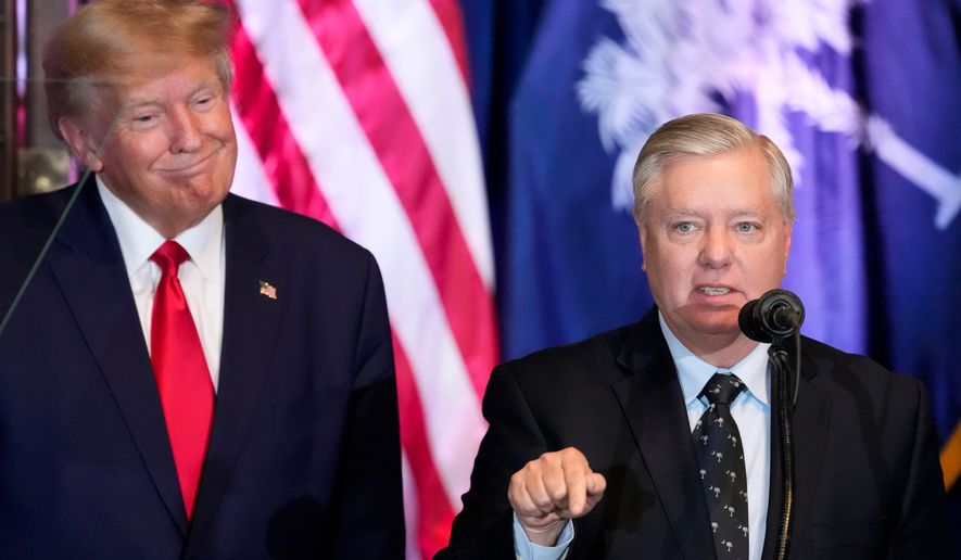 FILE - Former President Donald Trump listens as Sen. Lindsey Graham, R-S.C., speaks at a campaign event at the South Carolina Statehouse, Jan. 28, 2023, in Columbia, S.C. (AP Photo/Alex Brandon, File)