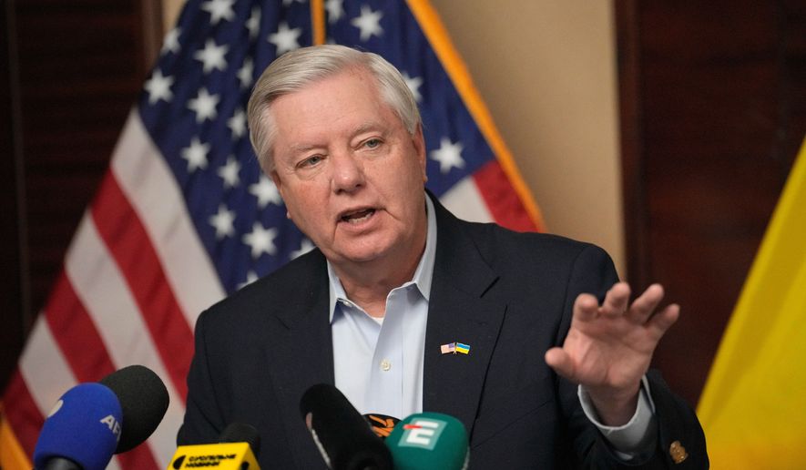 U.S. Sen. Lindsey Graham, R-S.C., gestures as he speaks to the media in Kyiv, Ukraine, March 18, 2024. (AP Photo/Vadim Ghirda, File)